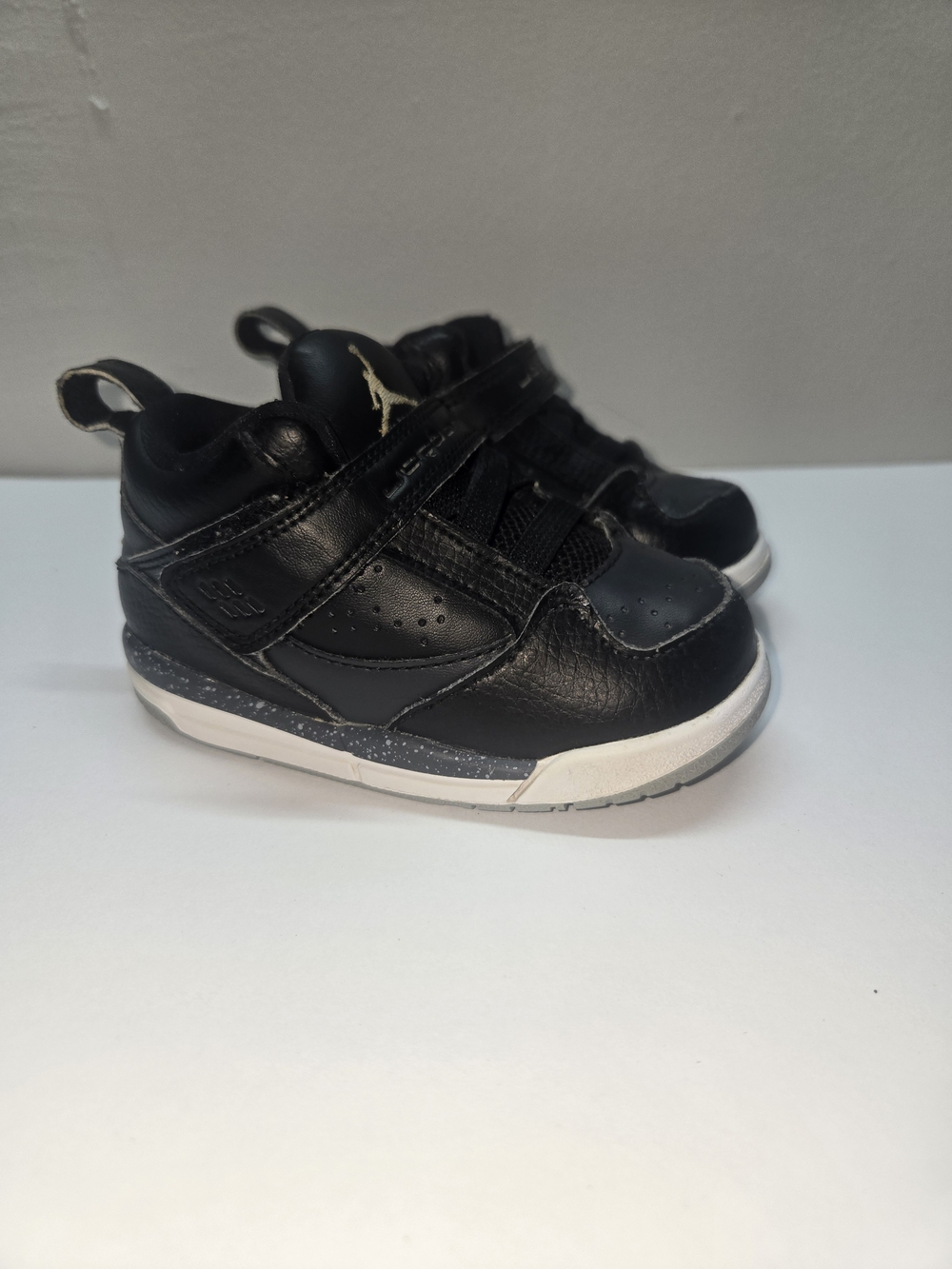 Jordan Kids Black and White High-Top Sneakers